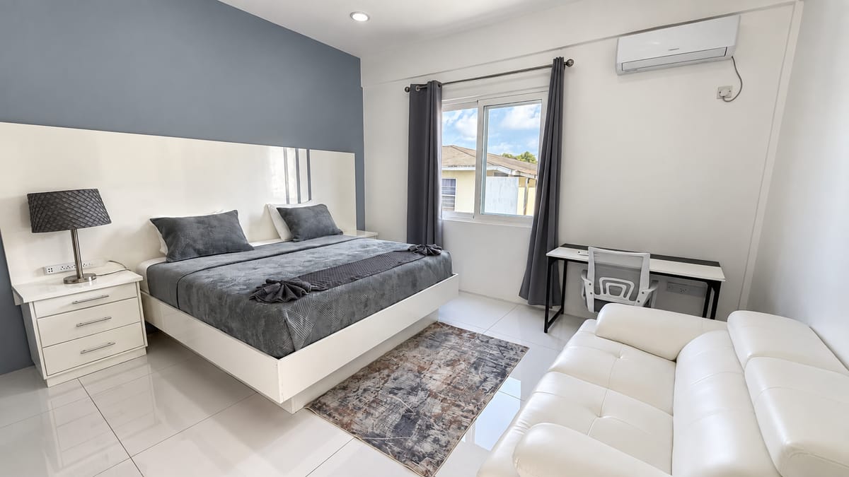 5-bedroom villa Rodney Bay bedroom with sofa, Paris Villas