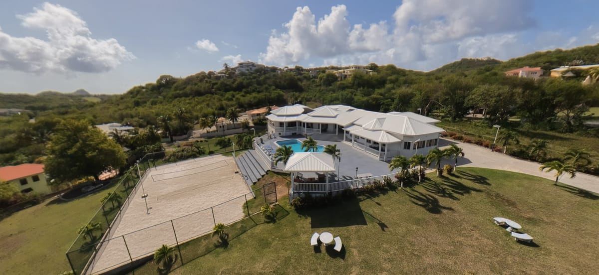 5-bedroom Cap Estate villa from the air, with pool and beach volleyball court, Paris Villas
