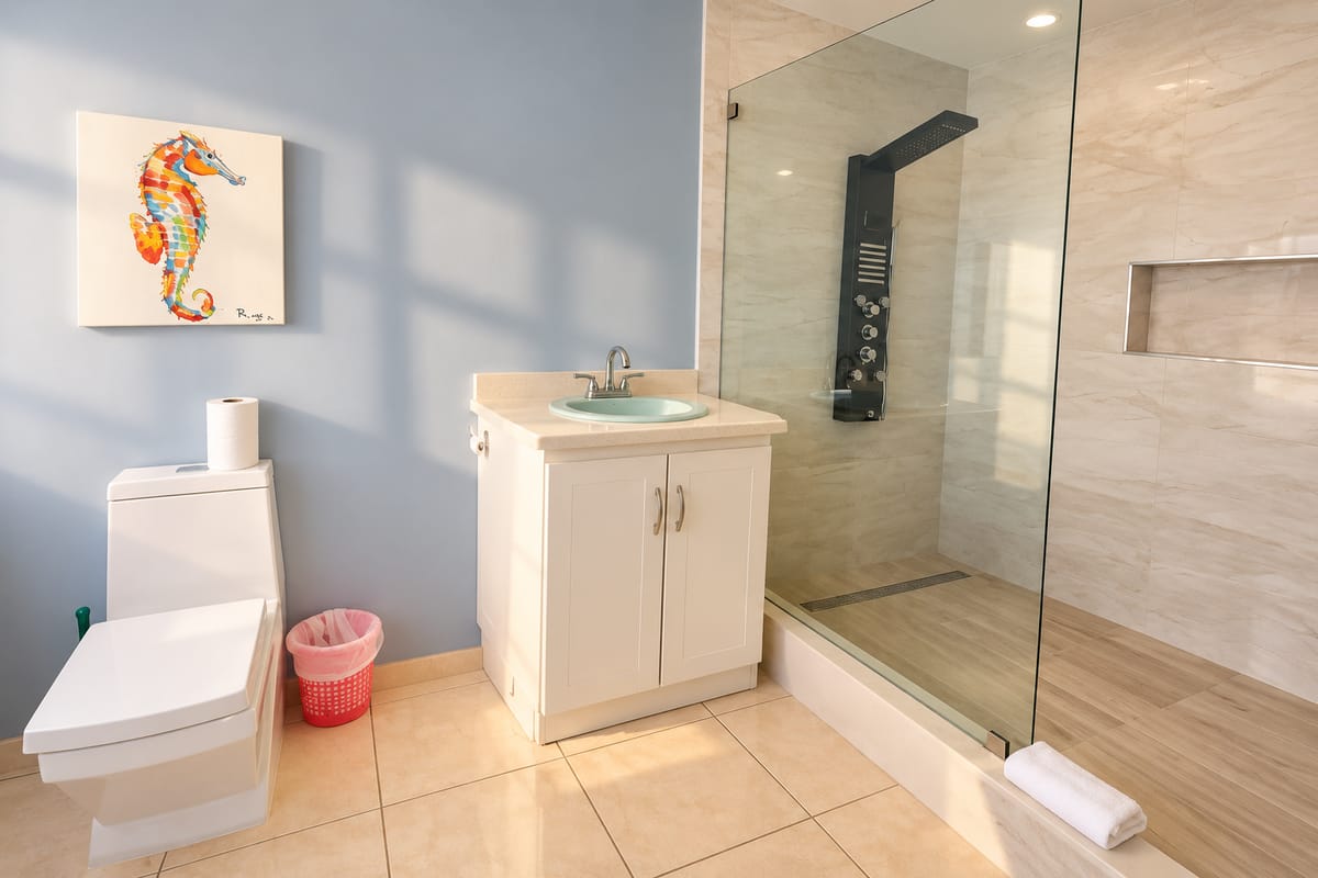 Cap Estate villa en-suite bathroom with glass rain shower, Paris Villas